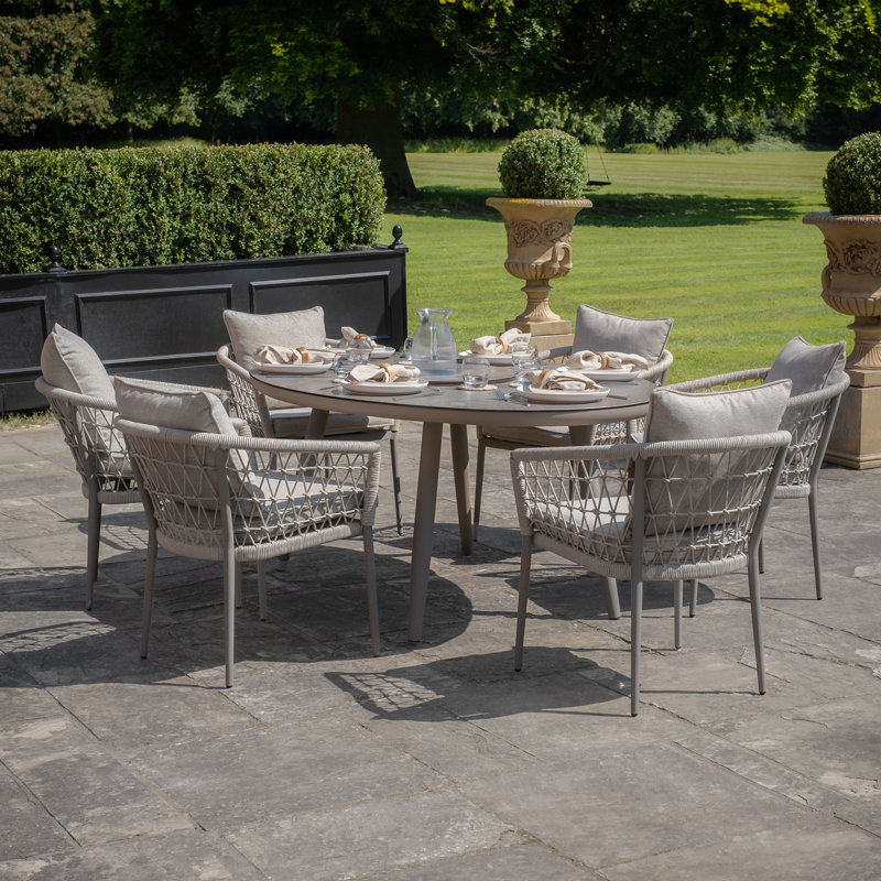 Anandi 6 - Person Patio Dining Set with Oval Table