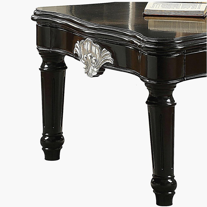 Table basse noire à pieds rotatifs
