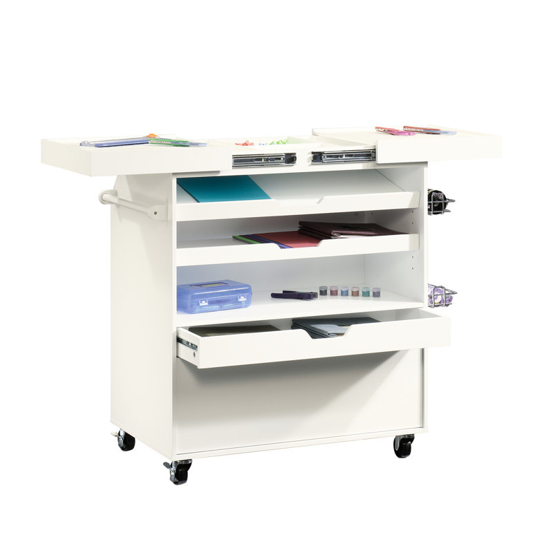 Chariot artisanal blanc avec design traditionnel, surface de travail coulissante, rangement et chariot pour petits objets dissimulés, plan de travail, rangement, deux tiroirs, mobilité en métal