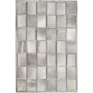 Tapis gris vache géométrique fait main Stamant