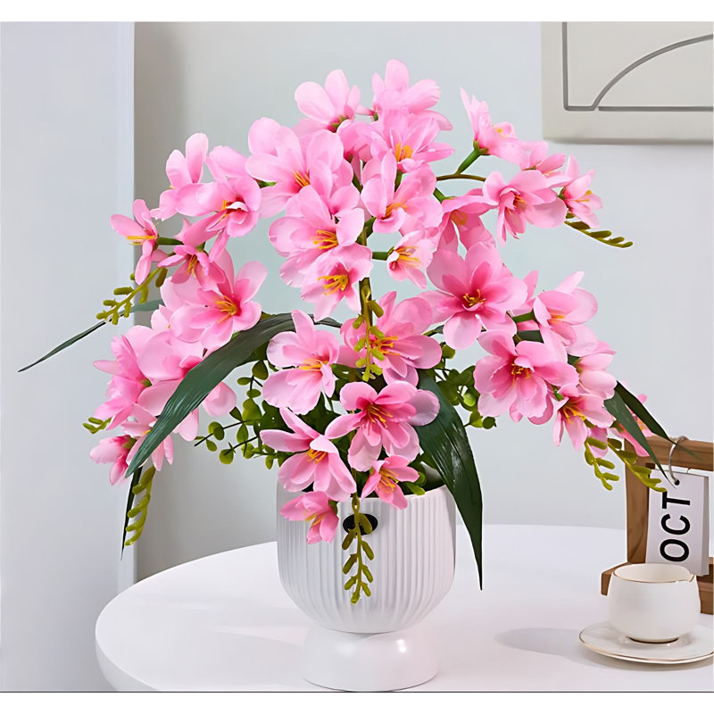 Arrangement de xiangxulan dans un vase, Rose