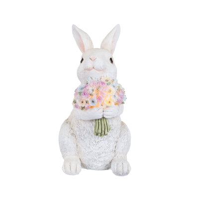 Lapin de Pâques avec bouquet de fleurs illuminé