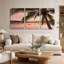 Ensemble de 3 toiles murales représentant un coucher de soleil rose encadrant un palmier sur la baie.-363811453