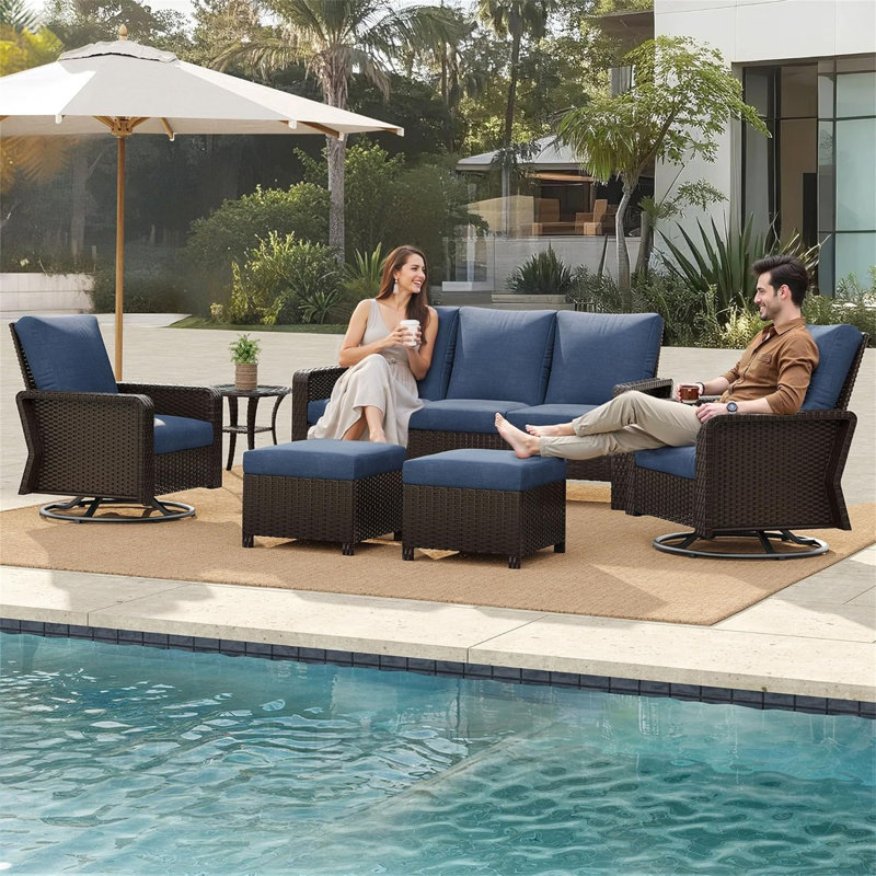 A Three-Seater Sofa + Two Swivel Chairs + Two Footstools + A Side Table