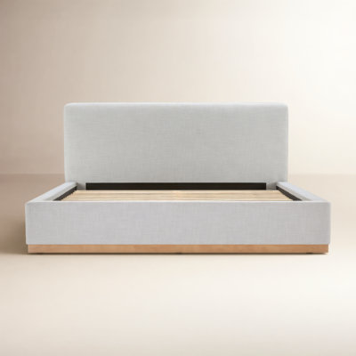 Delpha Grounded Upholstered Wood Base Bed