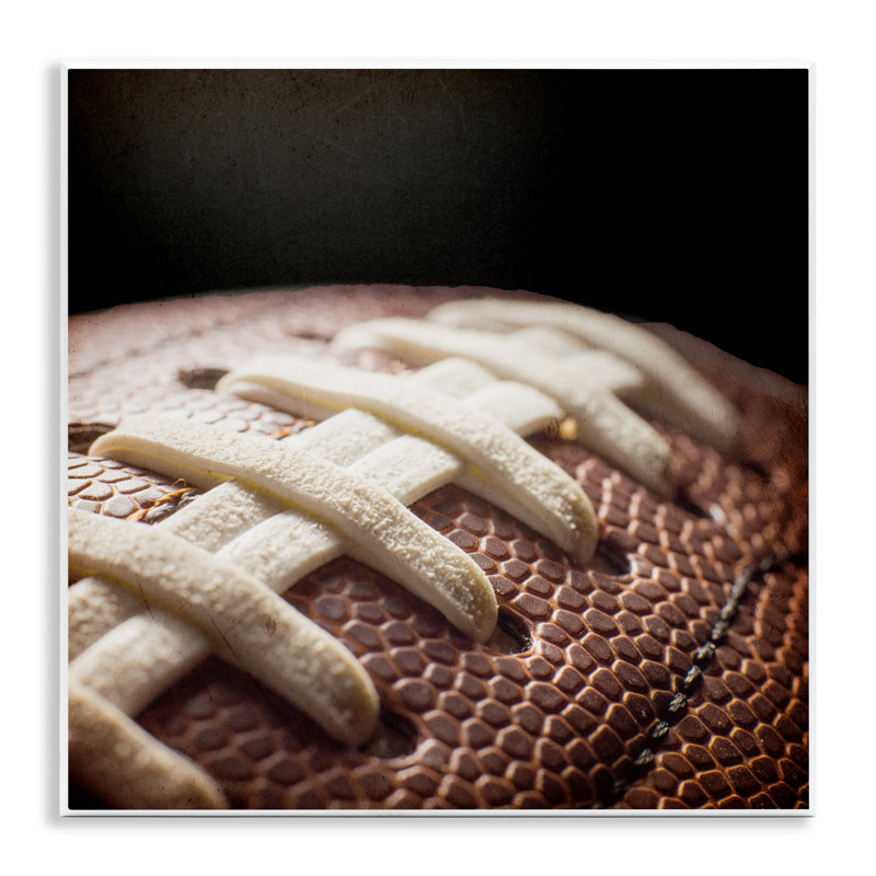 Football Closeup On Black Wall Plaque, design by Kim Allen