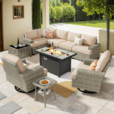 7- Person Rattan Outdoor Seating Group With Swivel Rockers and Fire Pit Table