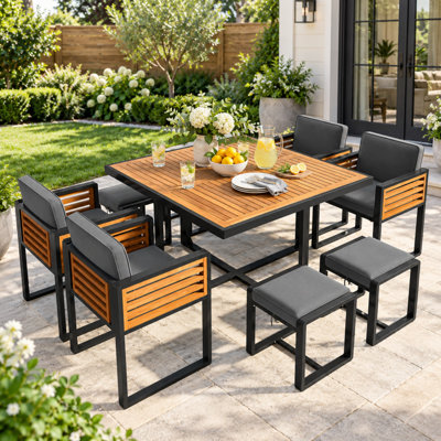 Arivent 9 Piece Solid wood Patio Dining Set with Cushioned Chairs and Ottomans