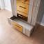 Commode dorée en bois gris