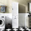 Armoire à linge blanche compacte avec matériaux et espace de rangement Tablette fonctionnelle compacte