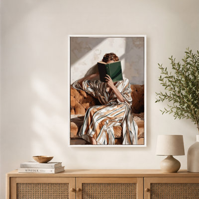 Woman Reading Book on Couch Canvas Wall Art with Floating Frame, Ready to Hang