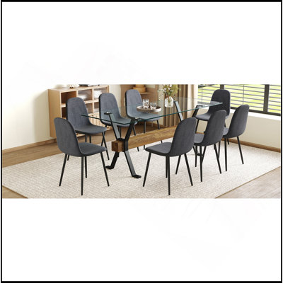 Ensemble de table et de chaises 79 po x 31,5 po avec pieds de table en métal noir en forme de X, traverse en panneau de fibres à densité moyenne à grain de bois texturé. Assorti de 10 chaises en tissu Lnen gris foncé. Pieds de pulvérisation en tube de fer.