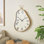 Cole And Grey Metal Wavy Decorative Wall Clock With Gold Frame And Black Accents