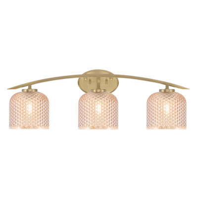 Kurve 3 Light Bath Bar Shown In New Age Brass Finish With 6" Amber Textured Glass