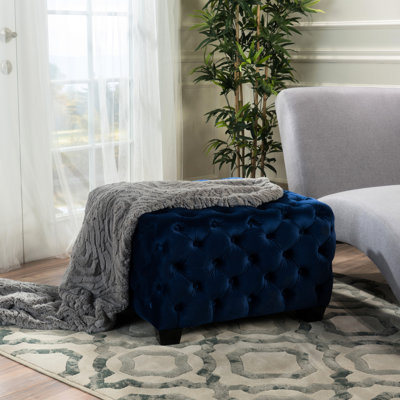 Surface moderne en velours bleu marine avec boutons capitonnés
