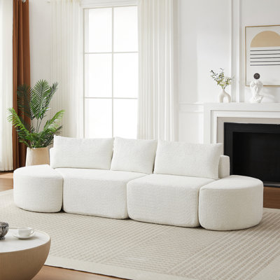Ensemble de canapé modulaire en forme de V de 106,3 pouces avec revêtement en chenille, deux repose-pieds courbés et trois coussins décoratifs polyvalents.