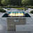 Propane Gas Fire Pit Table With Glass Wind Guard And An Open Basket-wave Patterned Wicker-947424578