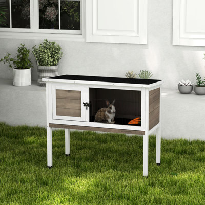 Elevated Wooden Rabbit For Single, Dwarf, Or Guinea Pig, Indoor/outdoor Placement, Brown Color, Hinged Asphalt Roof, Removable Tray, Space Under Stora
