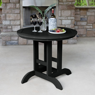 Arbnora 4 - Person Patio Dining Set with Round Table