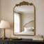 Miroir mural antique antique arqué avec cadre floral-130491465