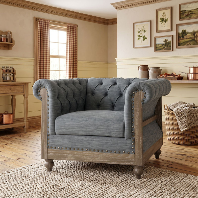 Fauteuil club capitonné avec pieds