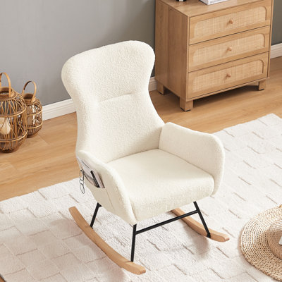 Chaise berçante en tissu rembourré de mousse avec structure en métal, recouverte de mousse