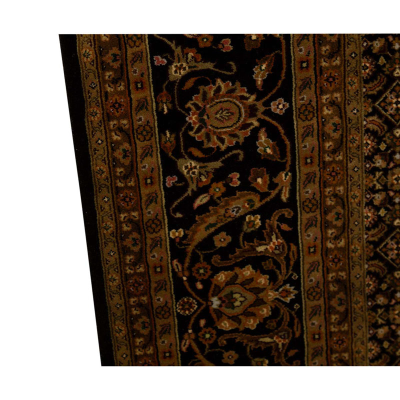 Tapis noir / rouille / mauve / vert noué à la main
