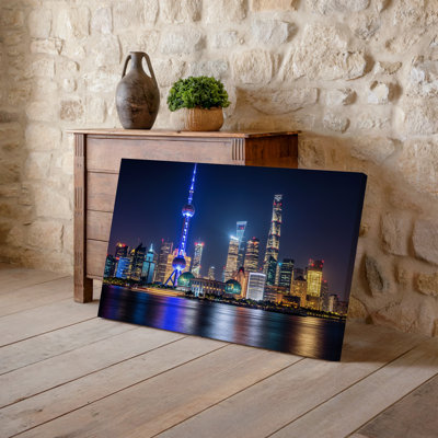 Canvas A Panoramic View Of A Vibrant City Skyline At Night Wall Art Showcasing Towering Skyscrapers Illuminated Against A Deep Black Canvas Wall Art