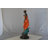 Young Lady In Orange Bronze Statue - Size: 7"L X 26"W X 25"H.