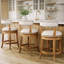 Tabouret de comptoir pivotant rembourré avec structure en bois massif Carollynn-1493860063