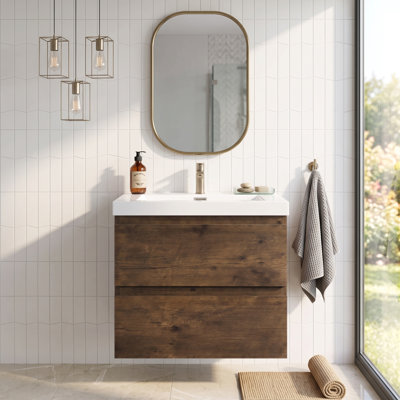 Meuble-lavabo suspendu de 61 cm (24 po) en bois mélaminé, de couleur bois de rose, avec lavabo intégré en résine blanche brillante et carbonate de calcium, et 2 tiroirs.