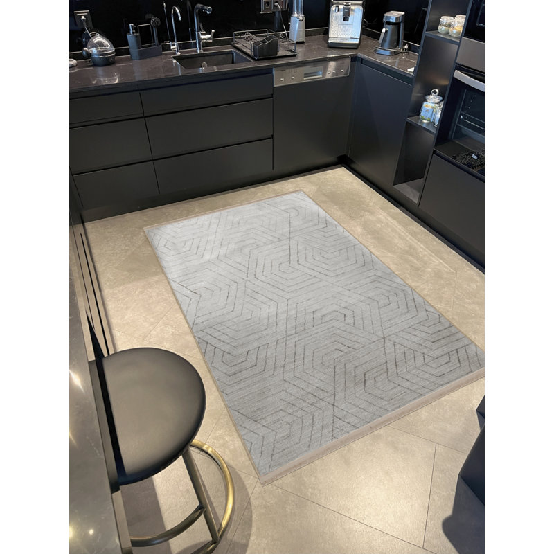 Tapis décoratif beige moderne à motifs géométriques et à franges