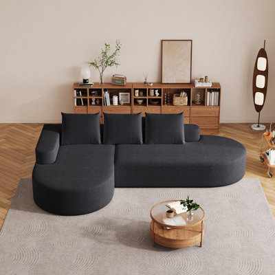 Élégant canapé arrondi en chenille haute résilience et assise très large pour une détente confortable