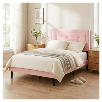 Structure de lit double tapissier avec tête de lit en velours, finition rose et lattes en bois massif pour le soutien du matelas