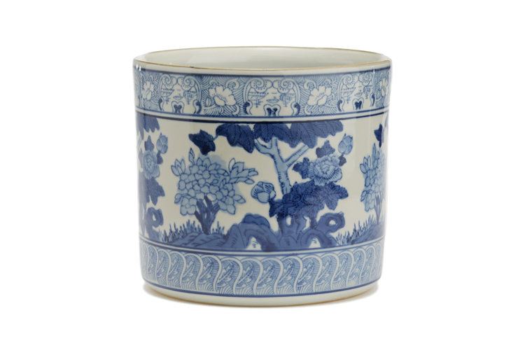 A blue Chinoiserie-inspired planter against a white background.