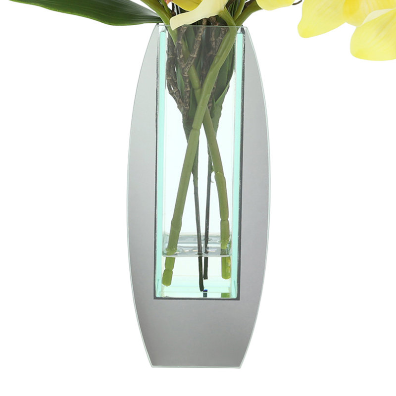 Arrangement d'orchidées dans un vase miroir, Jaune