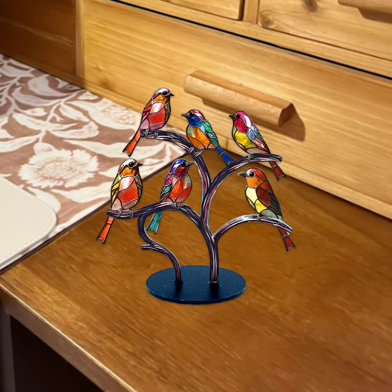 Figurine d'oiseau en acrylique sur une branche