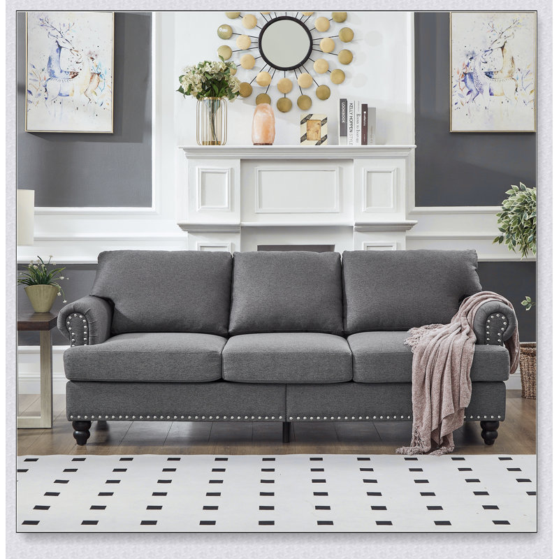 Canapé 3 places au design moderne et classique avec clous, alliant confort et élégance pour un look intemporel., Gris
