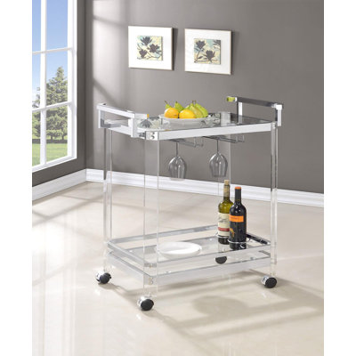 Catelynn Bar Cart with Glass Shelf in Clear by Orren Ellis