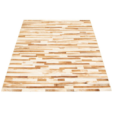 Avnee Cowhide Abstract Indoor Rug