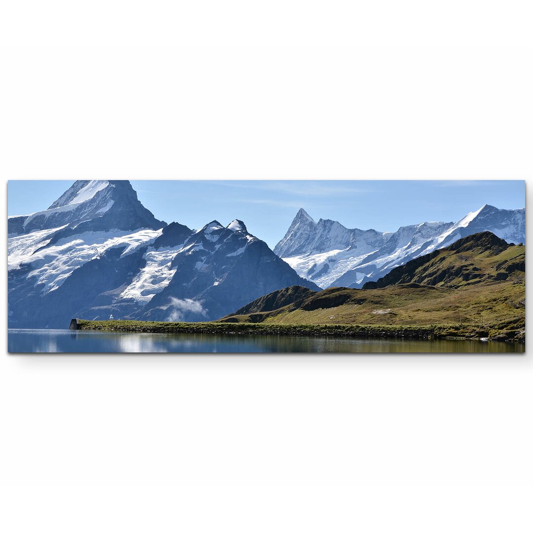 Leinwandbild Bergsee mit schneebedeckten Bergen - Schweiz