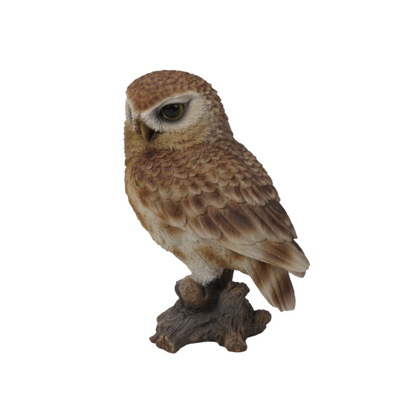 Statue hibou on souches