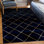 Tapis à carreaux bleu marine et doré Latitude Run®