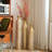 Set Of Three Distressed Metal Decorative Vases With Etched Vine Motifs, Tall Centerpiece Vases For Elegant Home Styling.