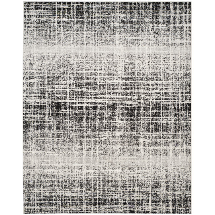 Riebe Black Area Rug