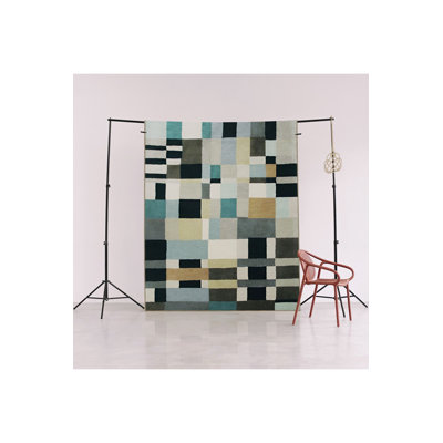 Tapis à motif géométrique mélangé bleu et noir