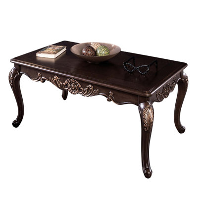 Traditional Dark Cherry Coffee Table with Ornate Carved Accents, Gold Highlights, and Cabriole Legs for Elegant Living Rooms