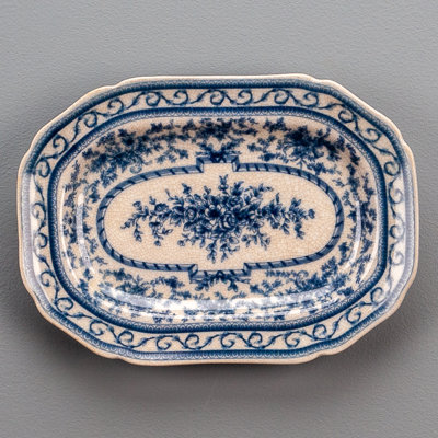 Blue and white Willow pattern porcelain decorative plate photographed for an online retailer listing