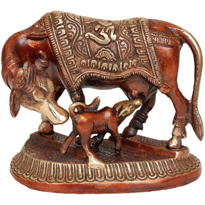 Vache et veau (selle décorée avec om)