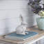 Statue de lapin en ciment patiné